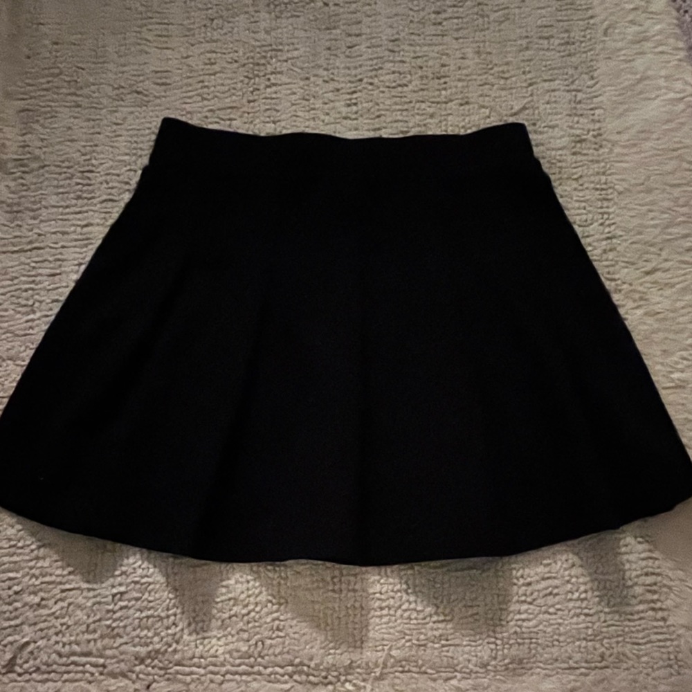 black pleated skirt